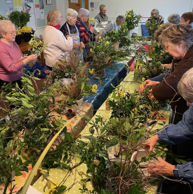 Enthusiastic flower arrangers at work
